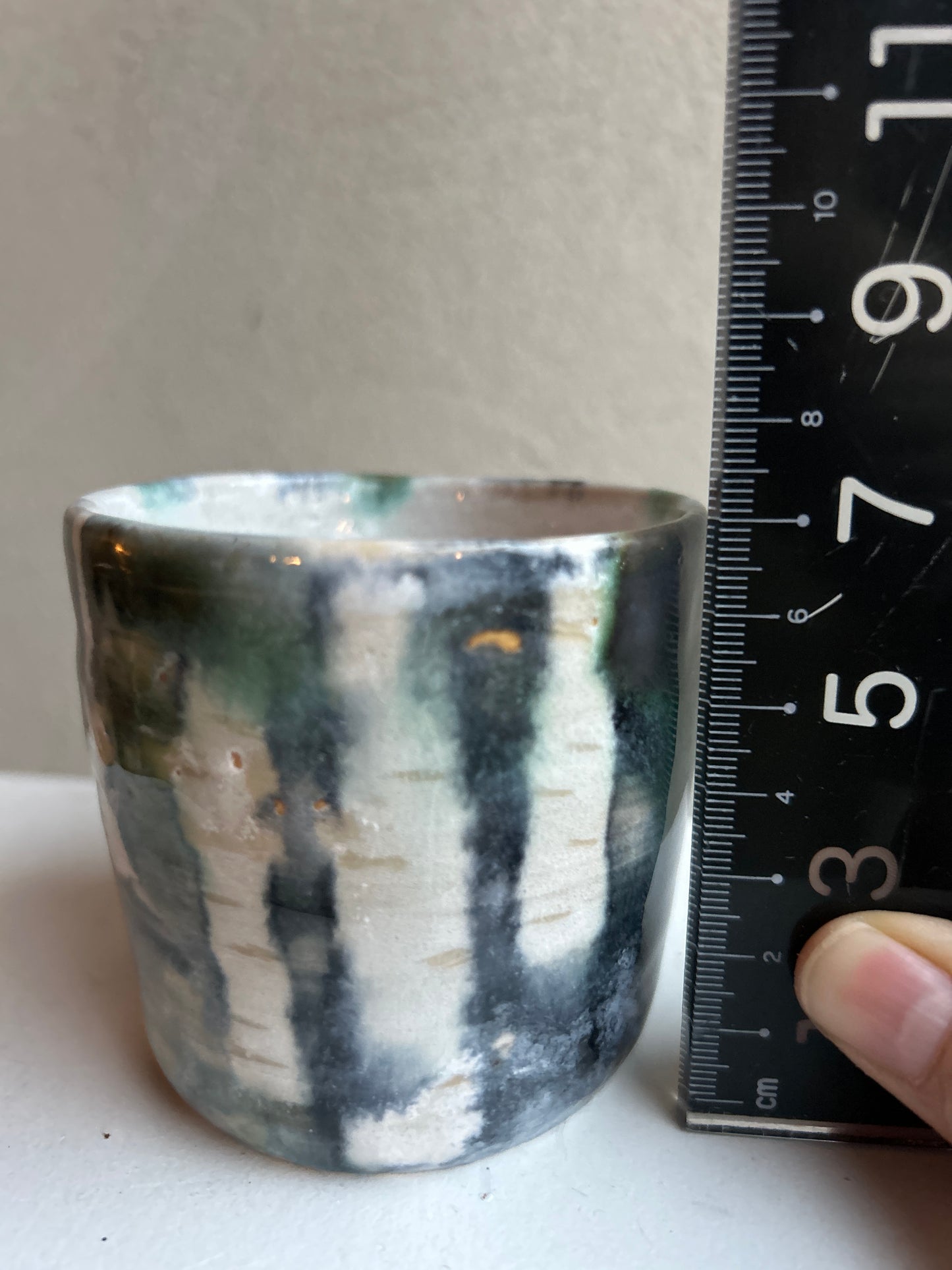 Bekertje met donker bos