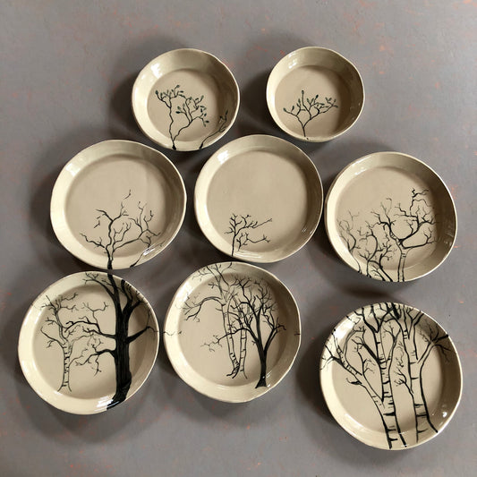 Plate set with forest motif